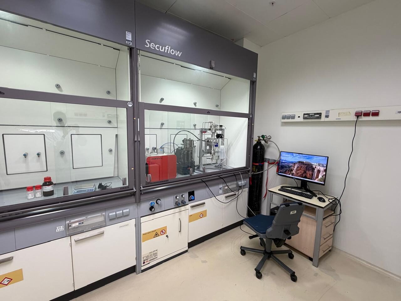 Flow chemistry equipment in a fume hood